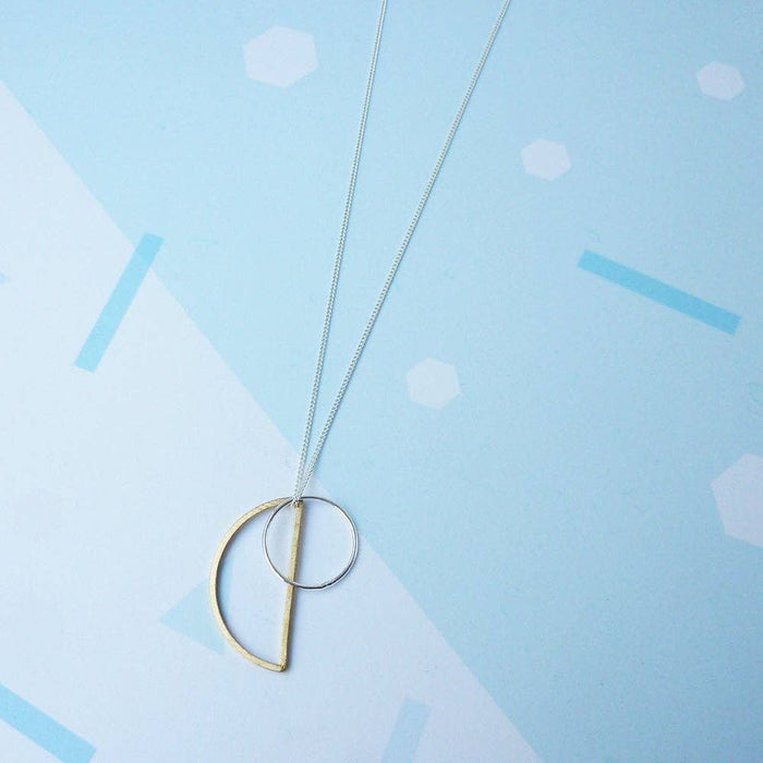 Locus, long sterling silver geometric charm necklace