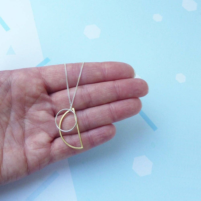 Locus, long sterling silver geometric charm necklace